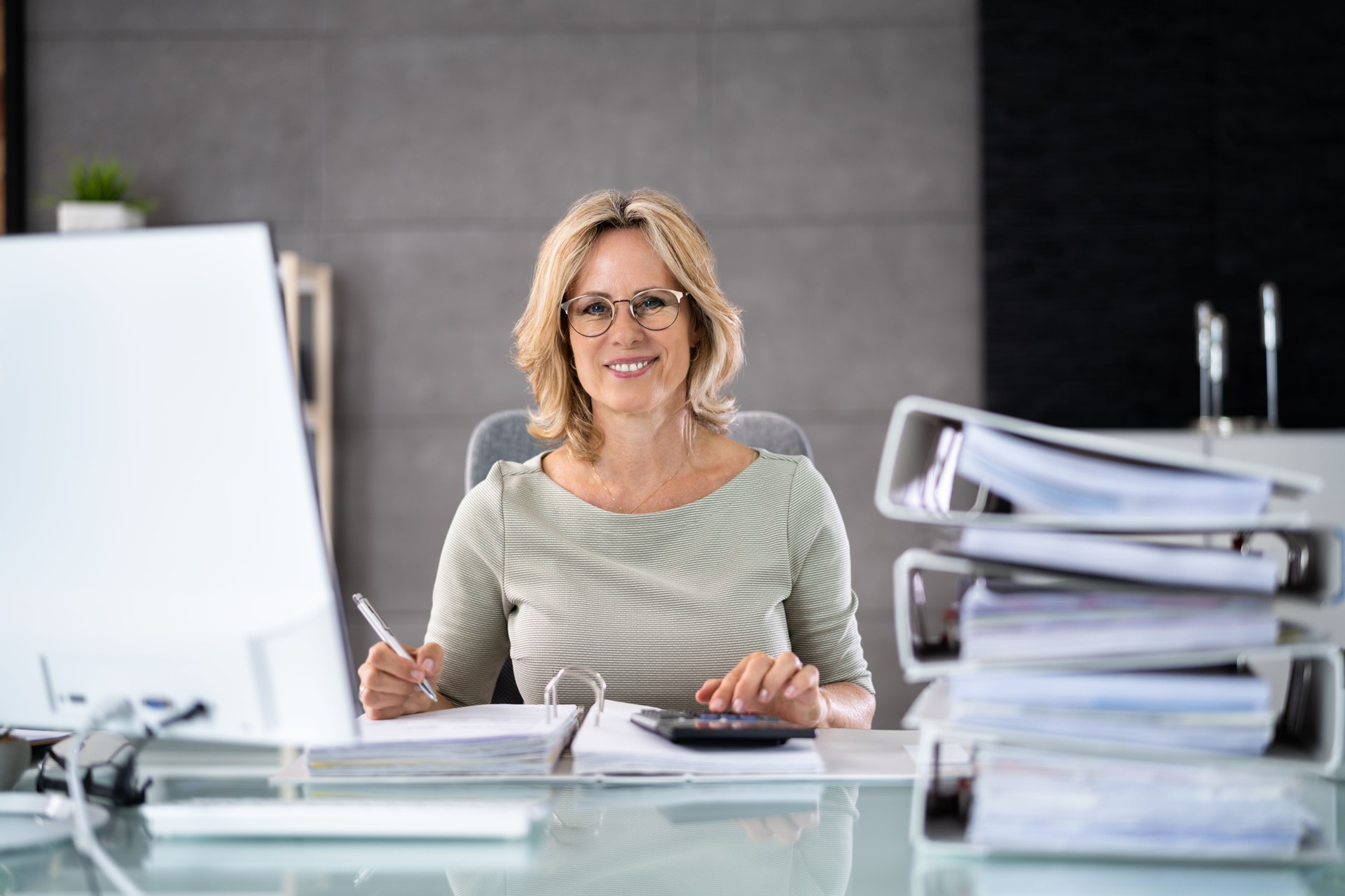Accountant With Folders Paper Stack Doing Invoice